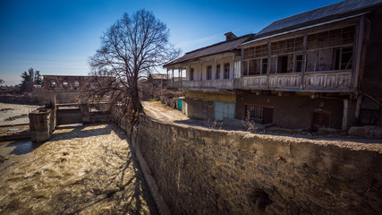 Fototapeta na wymiar River and street of old Tskhinvali