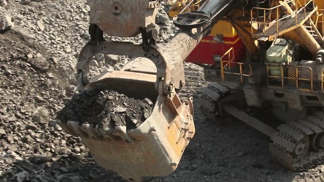 Bucket of industrial excavator close-up