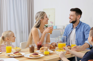 Happy family having breakfast on kitchen