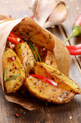 Boiled and baked potato in paper