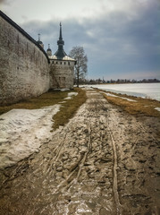Fototapeta na wymiar A dirty road along the walls of the Kremlin in Cherepovets
