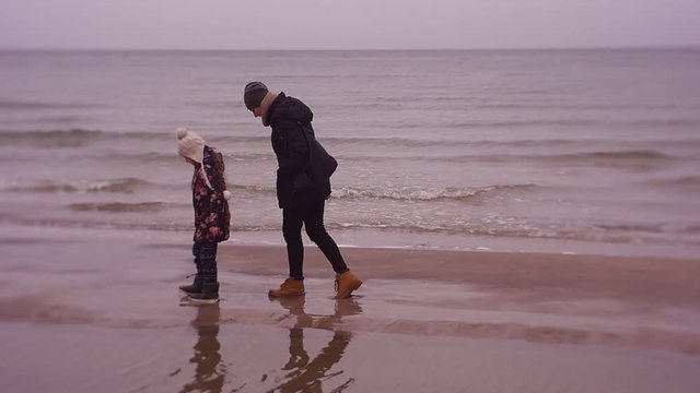 Active Day at the Beach, Family Weekend in Winter by the Sea. Winter Sea Walk
