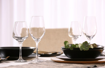 Table with beautiful setting in restaurant, closeup