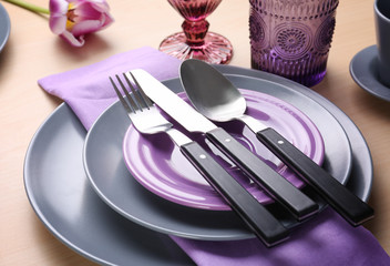 Beautiful table setting on light wooden background