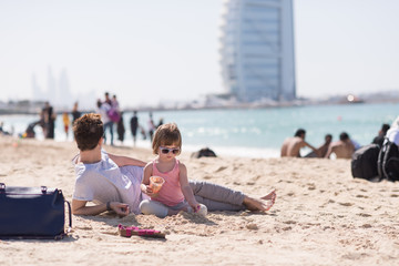 Mom and daughter on the beach