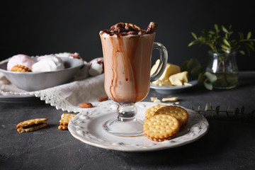 Composition with tasty cocoa drink on grey table