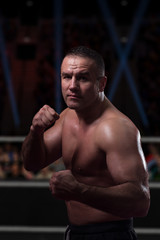 Obraz na płótnie Canvas professional kickboxer in the training ring