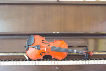 Violin on piano keys, closeup