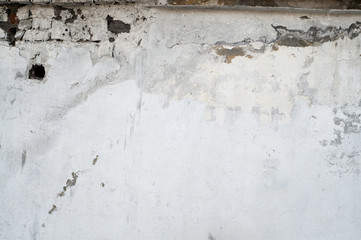 White wall with cracks