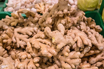 Fresh organic ginger roots background