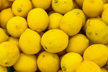 Colorful display of lemons in market