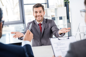 smiling businessman having job interview, business concept