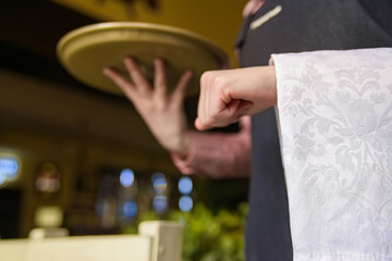 Yong waiter holds tray and napkin