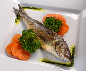 grilled fish on the ceramic plate