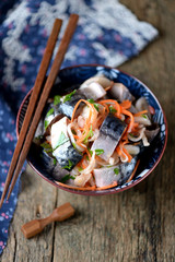 Marinated mackerel with onion and carrots in vinegar and olive oil. Korean food.