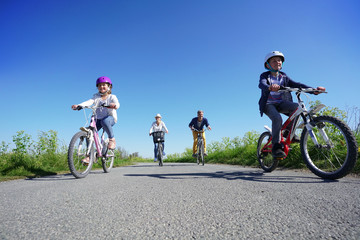 Fototapeta na wymiar Family of four on a biking day