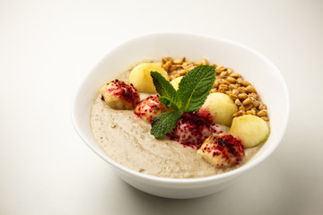 Porridge with apples and sprouted wheat. Theme of raw food, live food, healthy eating background