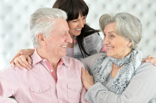 Happy Parents With An Adult Daughter