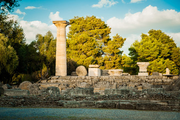 Greece, Olympia, Olympic flame is ignited at the site where the temple of Hera used to stand. Ruins of this place - obrazy, fototapety, plakaty