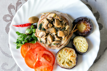 Lamb with mushrooms, fried zucchini, tomatoes and hot pepper