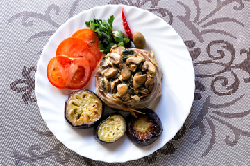 Lamb with mushrooms, fried zucchini, tomatoes and hot pepper