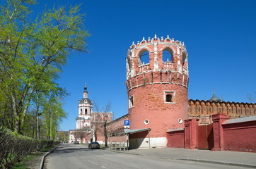 Obraz premium Donskoy monastery in Moscow, Russia. View of the bell tower with the Church of the righteous Zechariah and Elizabeth and towers