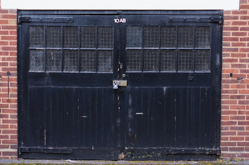 Old black double garage doors