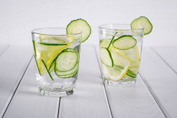 Refreshing  cucumber  cocktail, lemonade, detox water  in a glasses on a white background. Summer drink. 