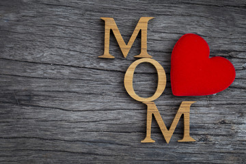 Wooden mom text on vintage wood background, Mother's day concept
