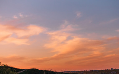 The sun sinks to the ground. Beautiful fiery sunset.