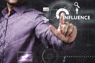 Business, Technology, Internet and network concept. Young businessman working on a virtual screen of the future and sees the inscription: Influence