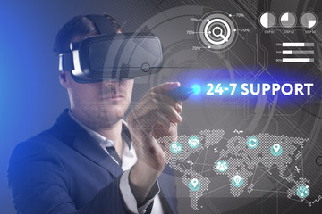 Business, Technology, Internet and network concept. Young businessman working in virtual reality glasses sees the inscription: 24-7 Support
