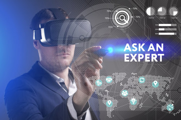 Business, Technology, Internet and network concept. Young businessman working in virtual reality glasses sees the inscription: Ask an expert