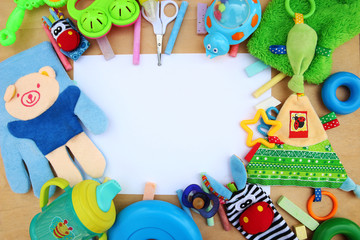 Children's toys and accessorieson a wooden background © dyageleva