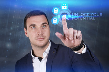 Business, Technology, Internet and network concept. Young businessman working on a virtual screen of the future and sees the inscription: Unlock your potential