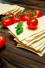 dried uncooked lasagna pasta sheets and tomato