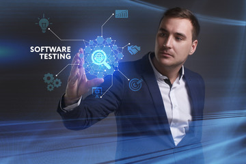 Business, Technology, Internet and network concept. Young businessman working on a virtual screen of the future and sees the inscription: Software testing