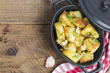 Baked potato, roasted potatoes with rosemary. Selective focus