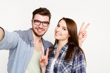 Couple taking selfie for social media, isolated