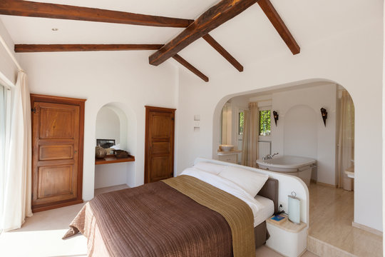 Elegant bedroom with bath tube