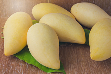 mango fruit on wooden background