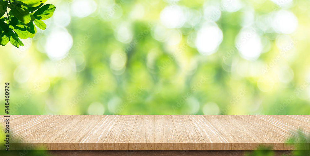 Aufkleber empty wood plank table top with blur park green nature background bokeh light,mock up for display or