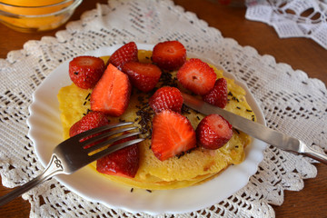 Sweet homemade pancakes strawberries and chocolate. 
