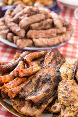 Barbecue meat and sausages served on the table