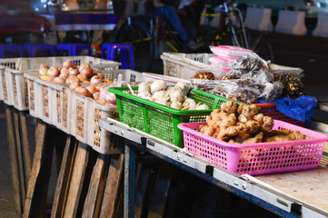 Vegetable vendor in night market.