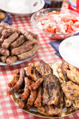 Barbecue meat and sausages served on the table