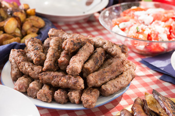 Barbecue meat and sausages served on the table