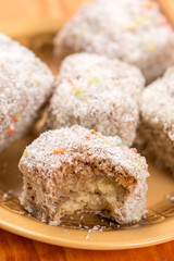Sliced chocolate cakes with coconut closeup macro