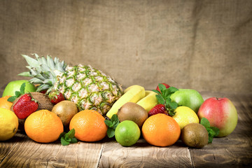 Healthy vegetarian food, fresh organic fruits on wooden table