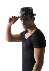 Young man with dark t-shirt and black and white checkered hat isolated on white background, looking at camera